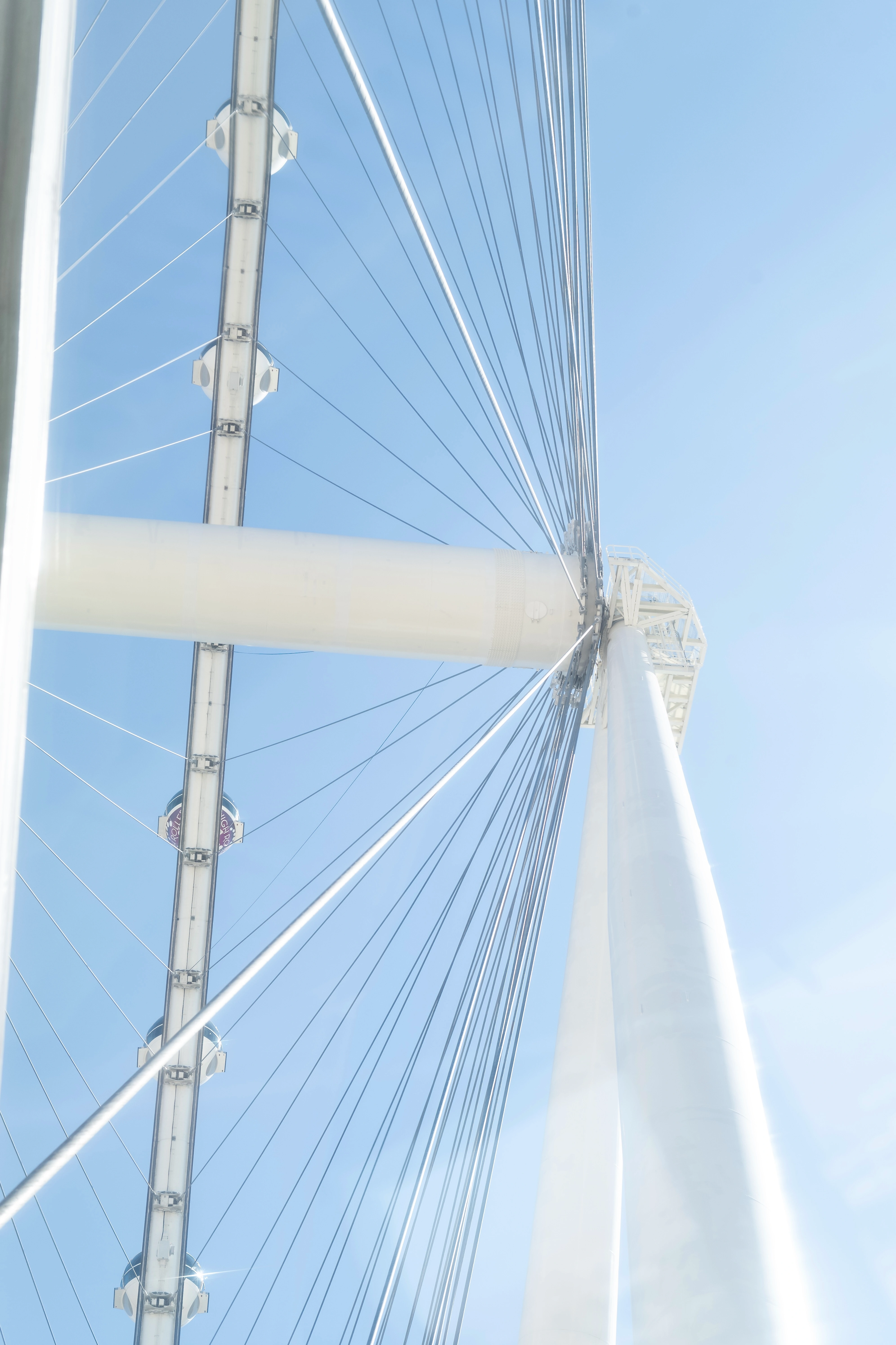 Modern-ferris-wheel-structure-against-blue-sky-scaled