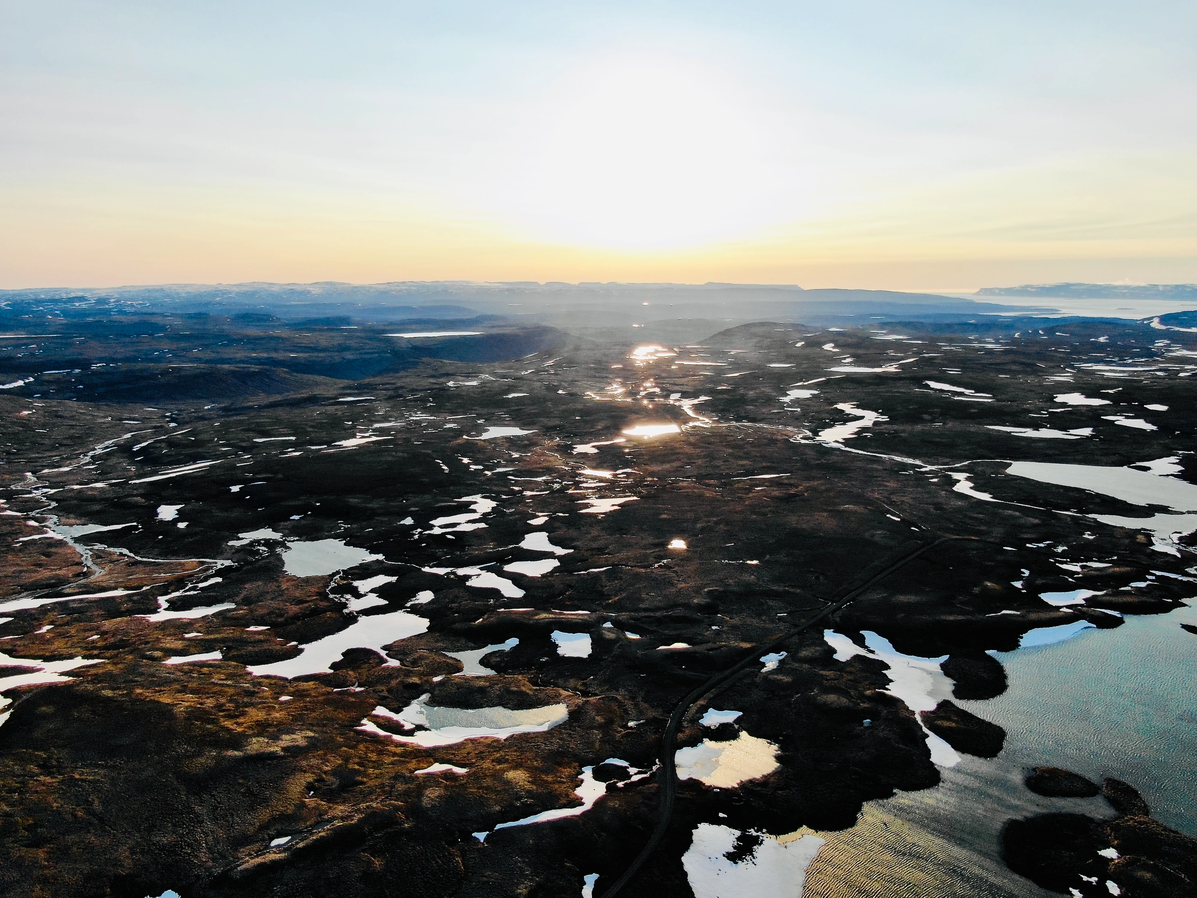 Sunset-over-frozen-lakes-and-mountains-scaled