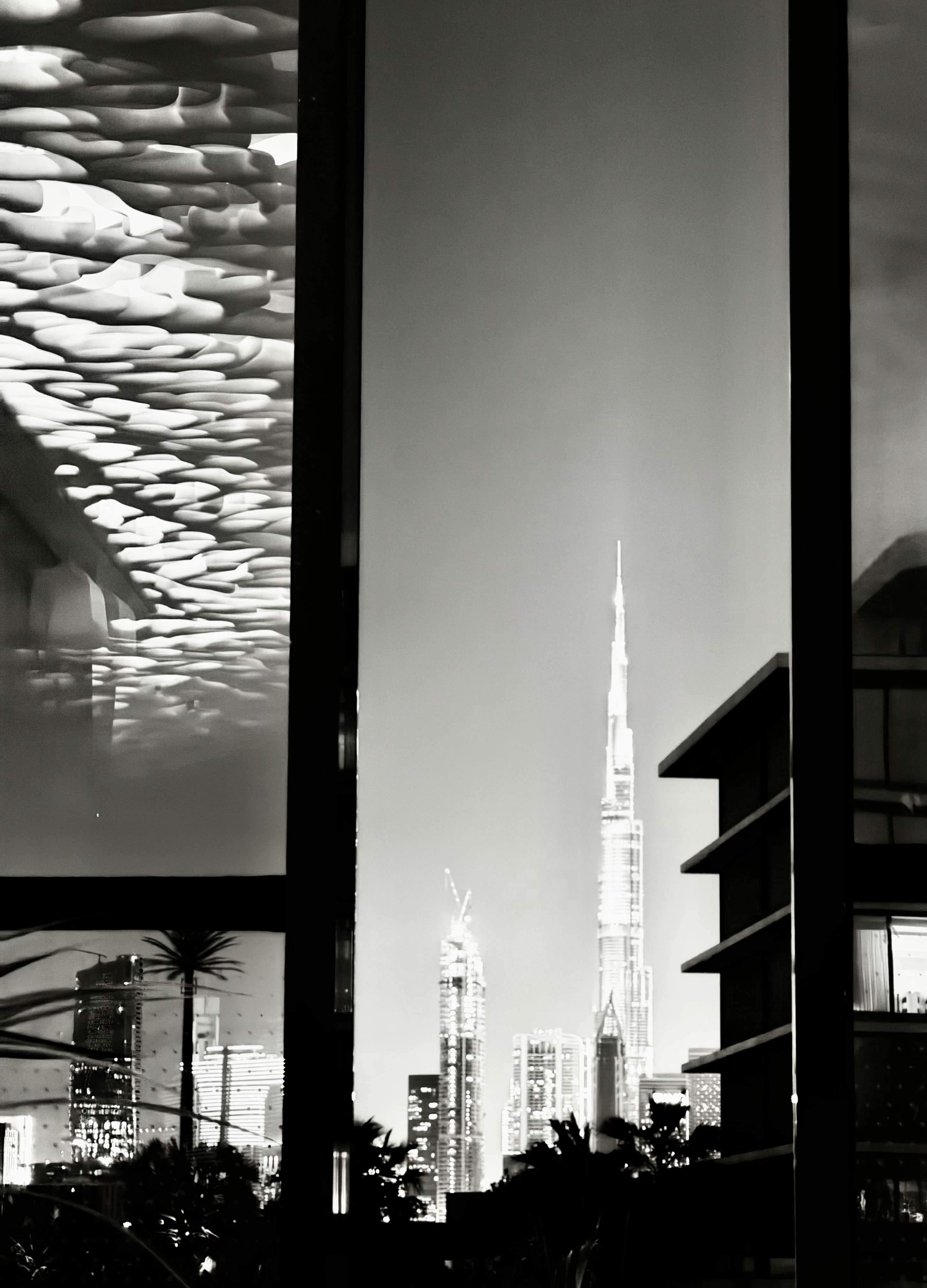cityscape-view-of-burj-khalifa-through-glass-window-1-scaled