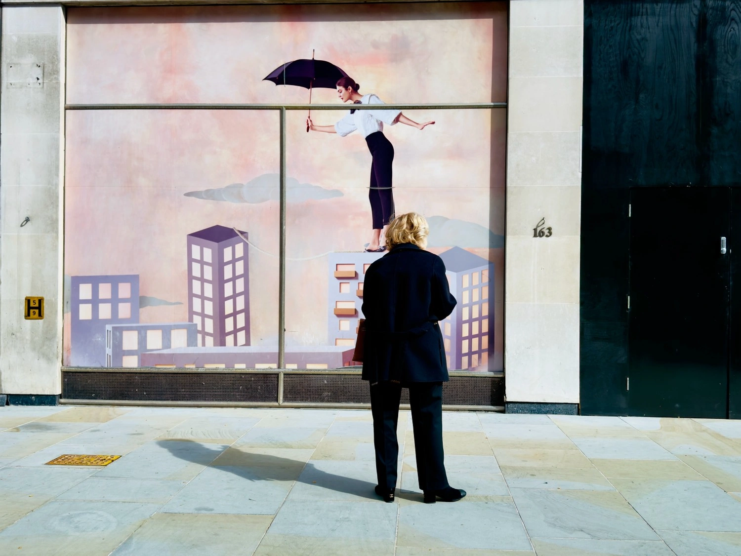 woman-looking-at-tightrope-walker-window-art